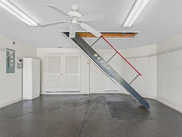 487 Thistledown Way, The Villages, FL 32162 - garage featuring ceiling fan and electric panel