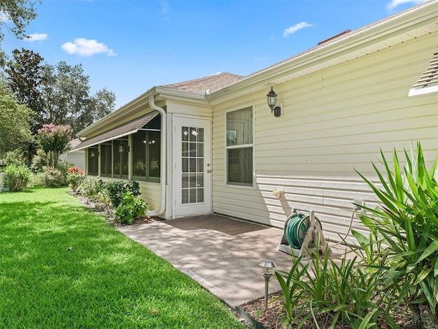 487 Thistledown Way, The Villages, FL 32162 - back of property with a yard, a patio area, and a sunroom
