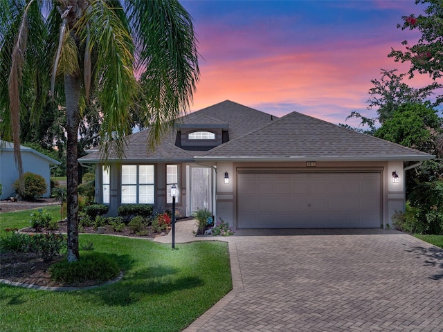 4814 Saint Andrews Arc, Leesburg, FL 34748 - single story home with stucco siding, decorative driveway, and an attached garage