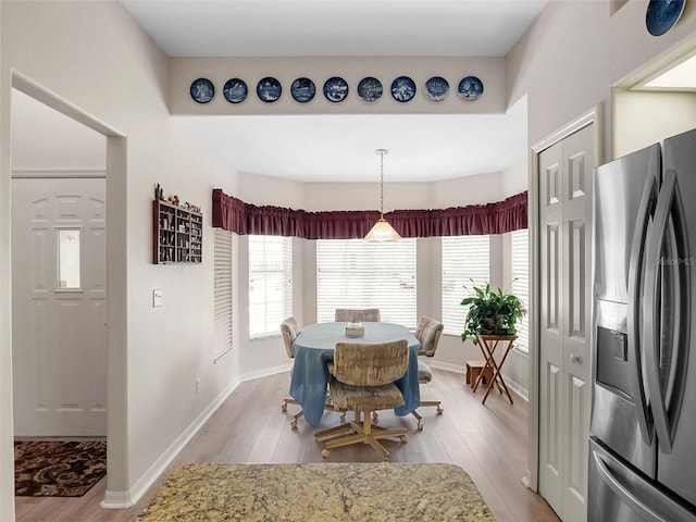 4814 Saint Andrews Arc, Leesburg, FL 34748 - dining area featuring light wood-style flooring