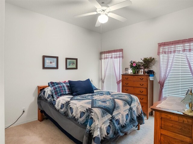 4814 Saint Andrews Arc, Leesburg, FL 34748 - bedroom with light carpet and a ceiling fan