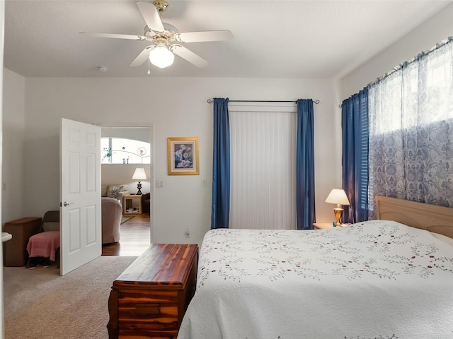 4814 Saint Andrews Arc, Leesburg, FL 34748 - carpeted bedroom featuring ceiling fan