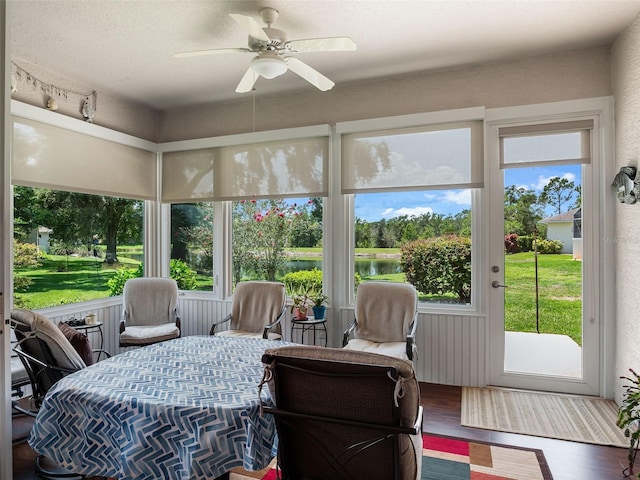 4814 Saint Andrews Arc, Leesburg, FL 34748 - sunroom / solarium with ceiling fan, a water view, and healthy amount of natural light