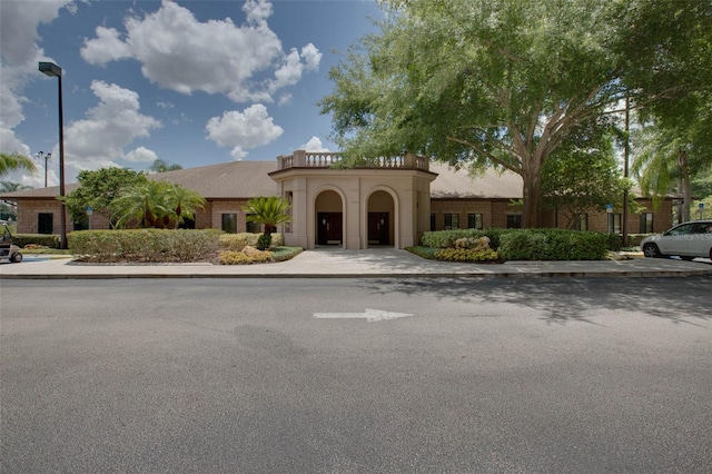 4814 Saint Andrews Arc, Leesburg, FL 34748 - mediterranean / spanish-style home featuring a balcony