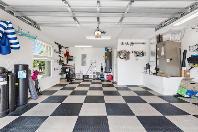 2465 Violet Ct, The Villages, FL 32162 - garage with electric water heater, a garage door opener, electric panel, and heating unit