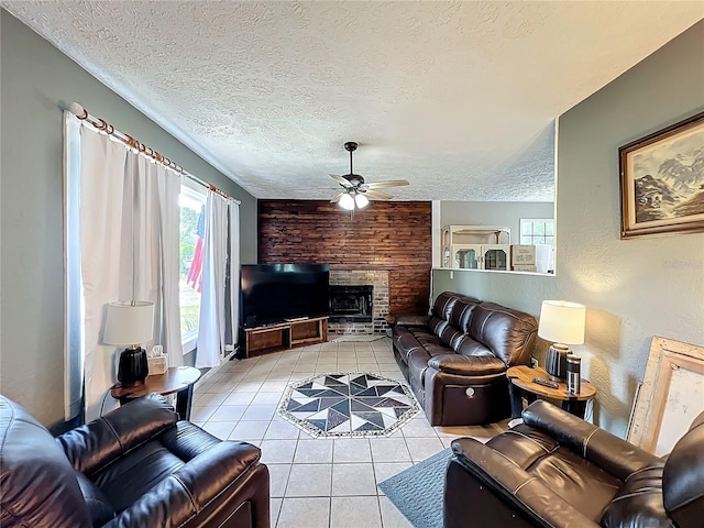 45 Forest Ln, Bronson, FL 32621 - living area with a ceiling fan, tile patterned flooring, plenty of natural light, a fireplace, and a textured ceiling