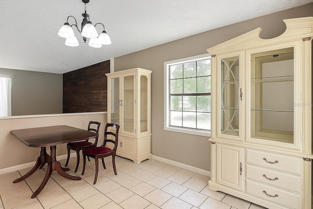 45 Forest Ln, Bronson, FL 32621 - dining area featuring a textured ceiling, a chandelier, and light tile patterned floors