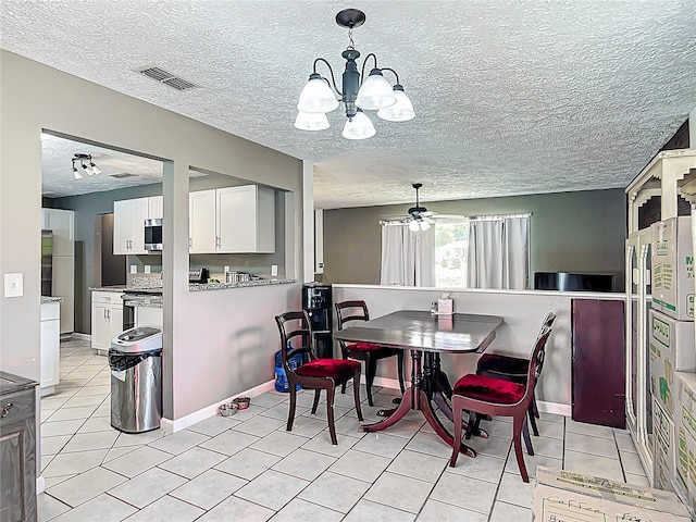 45 Forest Ln, Bronson, FL 32621 - dining space featuring light tile patterned floors, a chandelier, and a textured ceiling