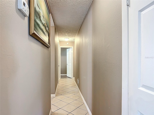 45 Forest Ln, Bronson, FL 32621 - corridor featuring a textured ceiling and light tile patterned flooring