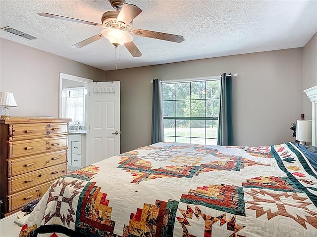 45 Forest Ln, Bronson, FL 32621 - bedroom with a textured ceiling, multiple windows, and ceiling fan