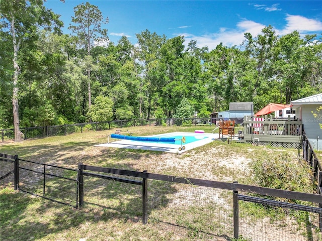 45 Forest Ln, Bronson, FL 32621 - view of swimming pool featuring a wooden deck and a fenced backyard