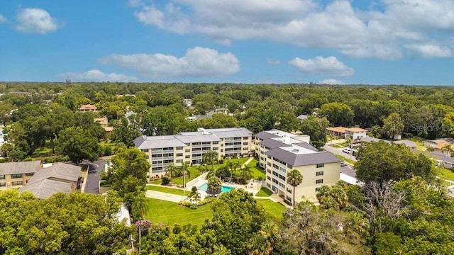 101 N Grandview St Unit 205, Mount Dora, FL 32757 - drone / aerial view of a pool area and a heavily wooded area