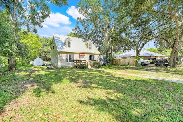 323 Savage Way, Groveland, FL 34736 - view of front facade featuring a storage shed and a metal roof