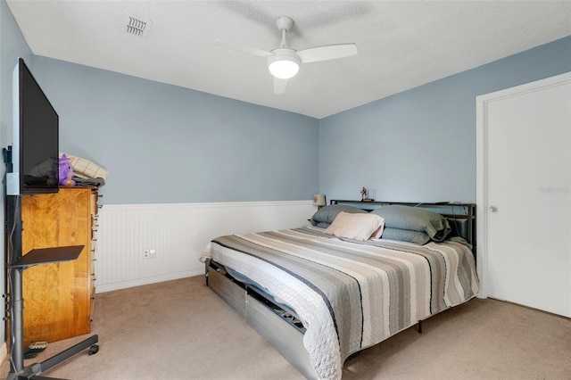 323 Savage Way, Groveland, FL 34736 - carpeted bedroom with wainscoting and ceiling fan