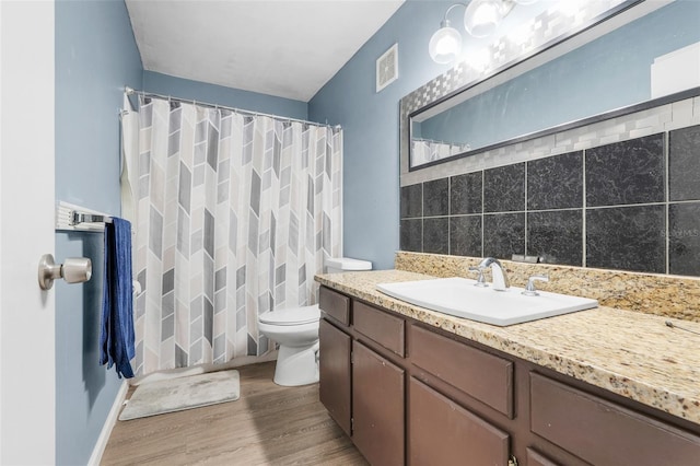 323 Savage Way, Groveland, FL 34736 - full bathroom with vanity, wood finished floors, and a shower with curtain