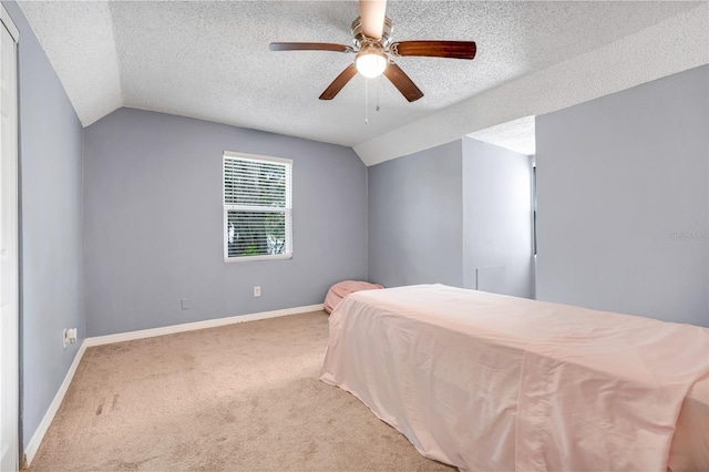 323 Savage Way, Groveland, FL 34736 - bedroom featuring lofted ceiling, carpet flooring, a textured ceiling, and a ceiling fan