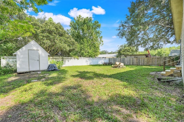 323 Savage Way, Groveland, FL 34736 - fenced backyard featuring a storage unit