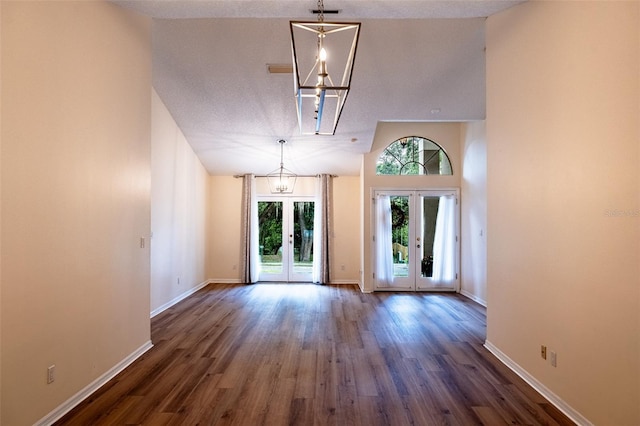 681 Greywood Dr, Altamonte Springs, FL 32701 - unfurnished room with french doors, vaulted ceiling, dark wood-type flooring, and a chandelier