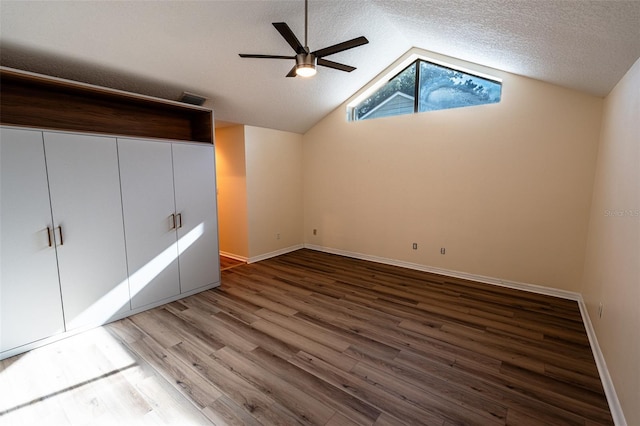 681 Greywood Dr, Altamonte Springs, FL 32701 - unfurnished bedroom with wood finished floors, lofted ceiling, a textured ceiling, and a ceiling fan