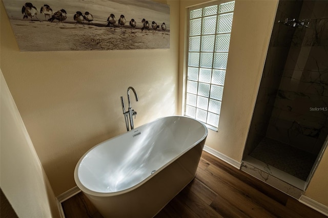 681 Greywood Dr, Altamonte Springs, FL 32701 - bathroom with wood finished floors, a tile shower, and a soaking tub