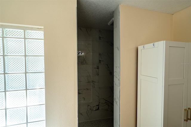 681 Greywood Dr, Altamonte Springs, FL 32701 - full bathroom featuring a marble finish shower and a textured ceiling