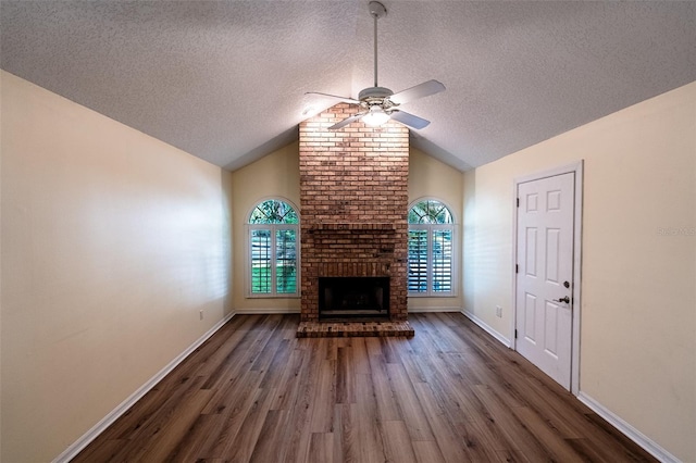 681 Greywood Dr, Altamonte Springs, FL 32701 - unfurnished living room with a ceiling fan, wood finished floors, a textured ceiling, healthy amount of natural light, and vaulted ceiling