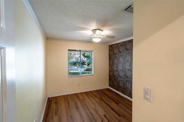 681 Greywood Dr, Altamonte Springs, FL 32701 - unfurnished room featuring wood finished floors, ornamental molding, a ceiling fan, and a textured ceiling