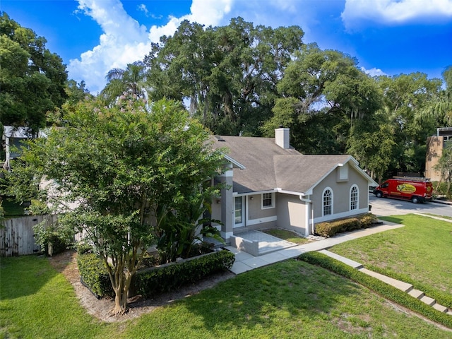 681 Greywood Dr, Altamonte Springs, FL 32701 - obstructed view of property featuring stucco siding and a chimney