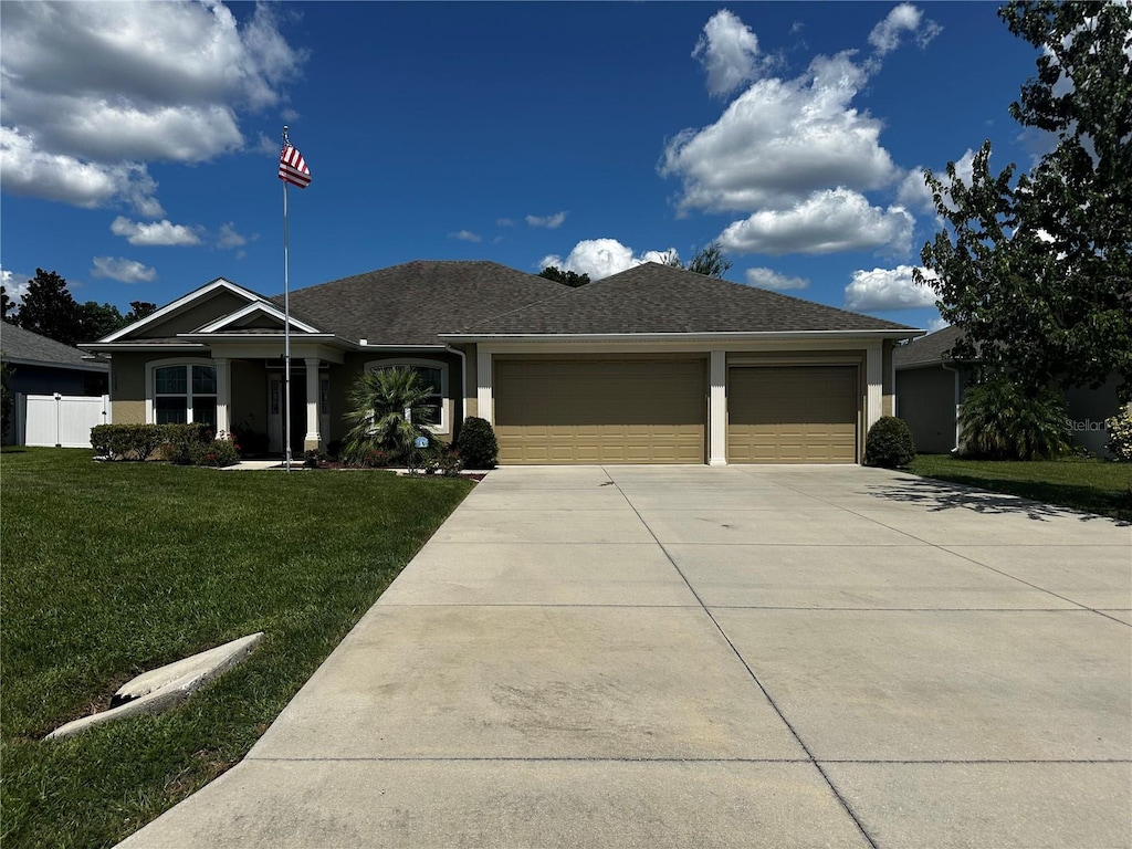 13109 Laurel Crest Ct, Grand Island, FL 32735 - ranch-style home featuring driveway, a garage, and stucco siding