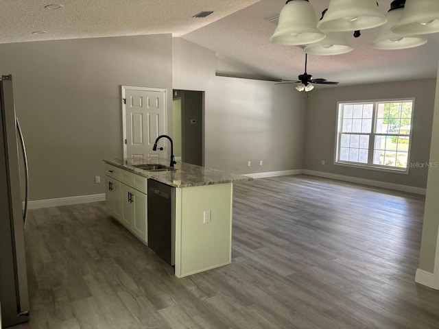 1176 W Bridge Dr, Citrus Springs, FL 34434 - kitchen with freestanding refrigerator, dishwasher, a textured ceiling, wood finished floors, and light stone counters