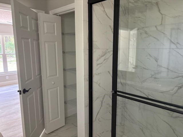 1176 W Bridge Dr, Citrus Springs, FL 34434 - full bath featuring marble look tiles and a marble finish shower