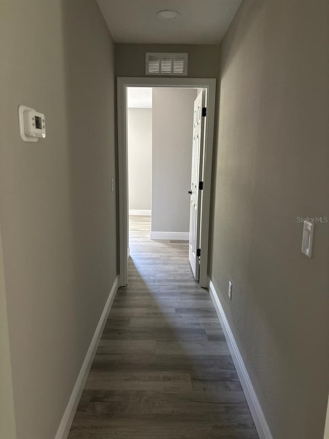 1176 W Bridge Dr, Citrus Springs, FL 34434 - corridor featuring dark wood-type flooring and baseboards