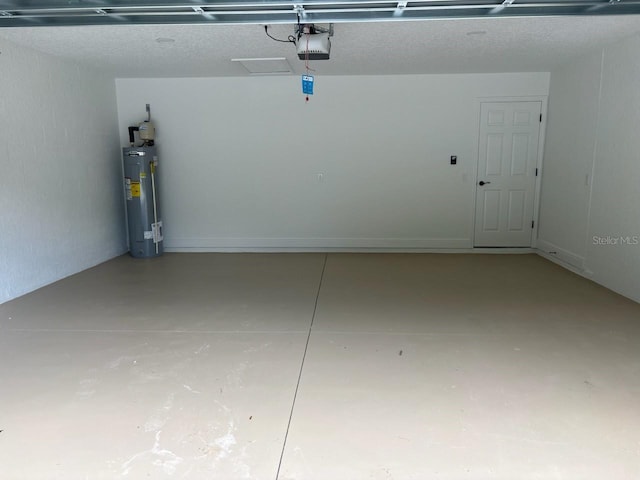 1176 W Bridge Dr, Citrus Springs, FL 34434 - garage featuring electric water heater and a garage door opener