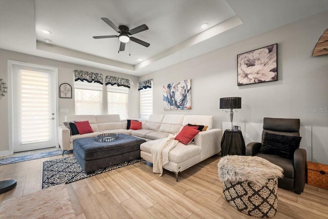 1055 Rustic Mill Dr, Saint Augustine, FL 32092 - living room with a raised ceiling, a ceiling fan, and wood finished floors