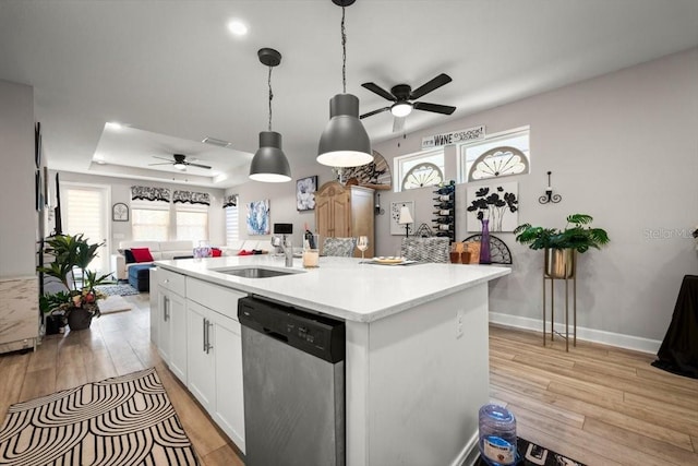 1055 Rustic Mill Dr, Saint Augustine, FL 32092 - kitchen with dishwasher, ceiling fan, open floor plan, and light wood-style floors