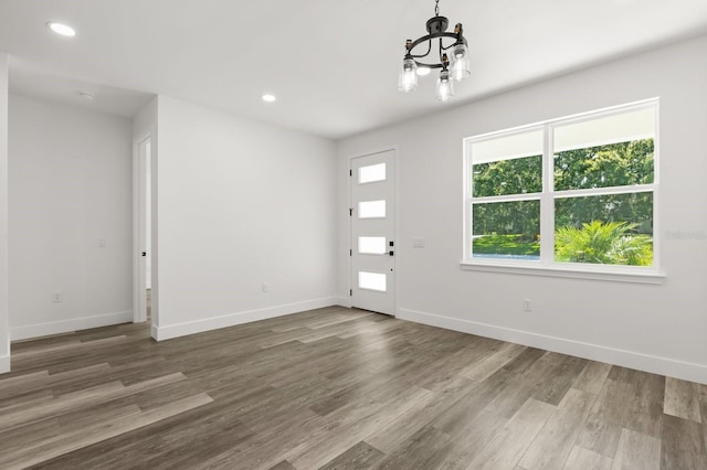 321 Watershore Dr, Leesburg, FL 34748 - foyer with a chandelier, wood finished floors, and recessed lighting
