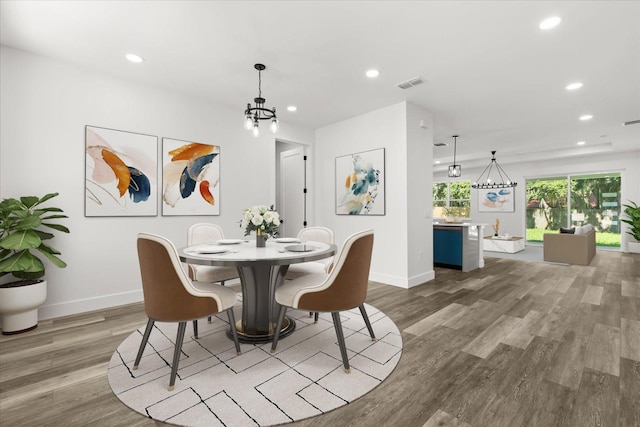321 Watershore Dr, Leesburg, FL 34748 - dining space with wood finished floors, recessed lighting, and a chandelier