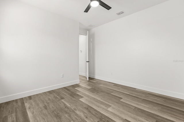 321 Watershore Dr, Leesburg, FL 34748 - spare room featuring a ceiling fan and wood finished floors