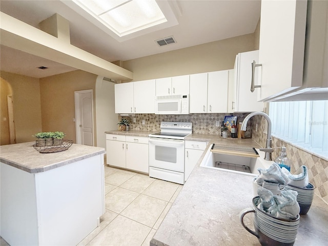 3416 Capland Ave, Clermont, FL 34711 - kitchen with white appliances, backsplash, light countertops, white cabinets, and light tile patterned floors