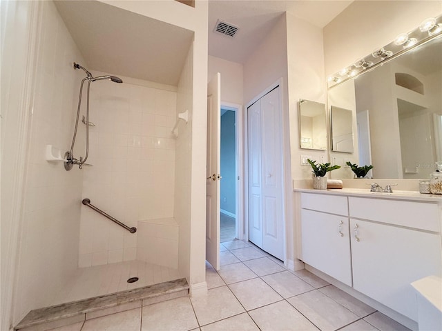 3416 Capland Ave, Clermont, FL 34711 - full bath featuring a tile shower, vanity, and tile patterned floors