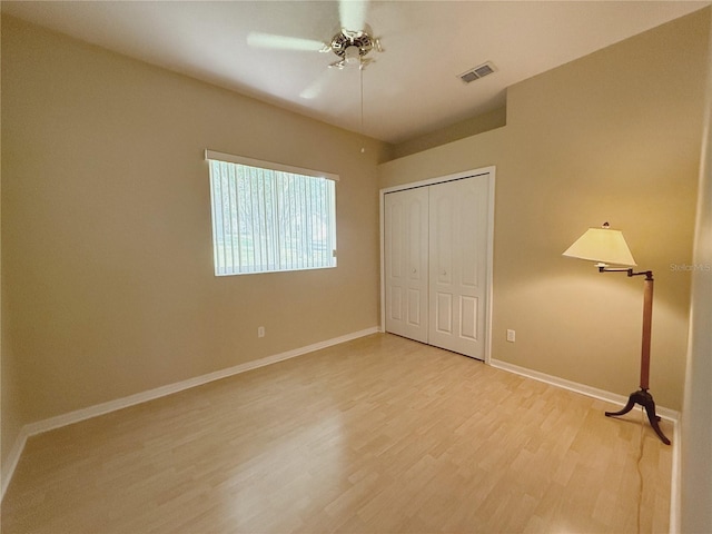 3416 Capland Ave, Clermont, FL 34711 - unfurnished bedroom with light wood-style floors, a closet, and ceiling fan