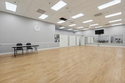 3416 Capland Ave, Clermont, FL 34711 - miscellaneous room with wood finished floors, a drop ceiling, and a skylight