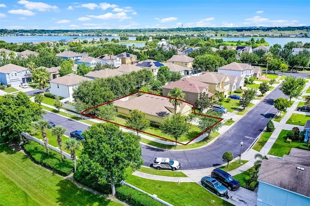 418 Rock Springs Cir, Groveland, FL 34736 - aerial view of residential area with property parcel outlined and a large body of water