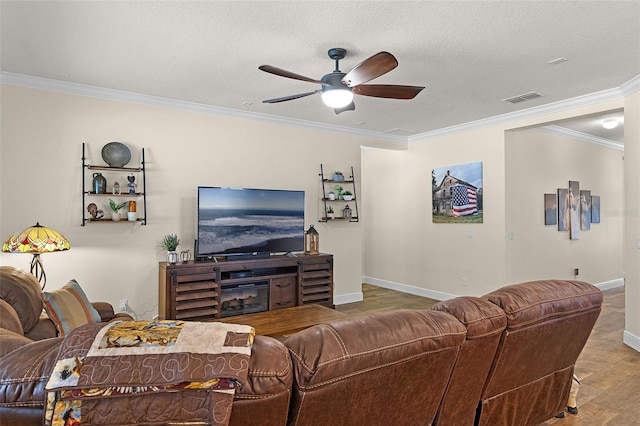 418 Rock Springs Cir, Groveland, FL 34736 - living area featuring crown molding, a ceiling fan, wood finished floors, and a textured ceiling