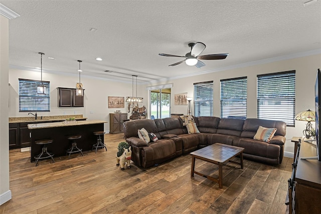 418 Rock Springs Cir, Groveland, FL 34736 - living room featuring a textured ceiling, wood finished floors, crown molding, a ceiling fan, and recessed lighting