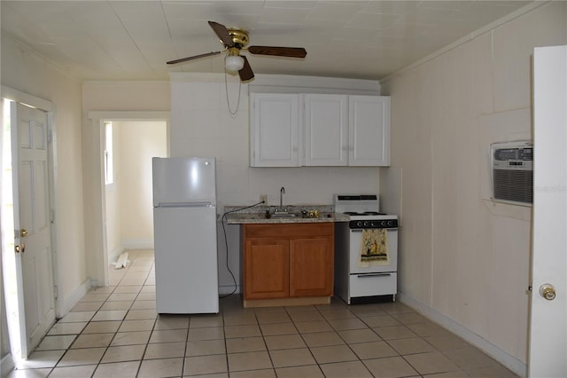 2611 Hiawatha Ave, Sanford, FL 32773 - kitchen with white appliances, a ceiling fan, light tile patterned floors, crown molding, and a wall unit AC