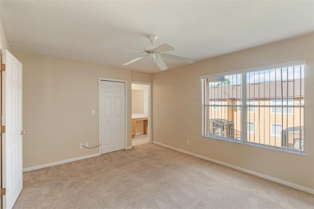 2717 Bushman Dr, Kissimmee, FL 34746 - unfurnished bedroom featuring light carpet and a ceiling fan