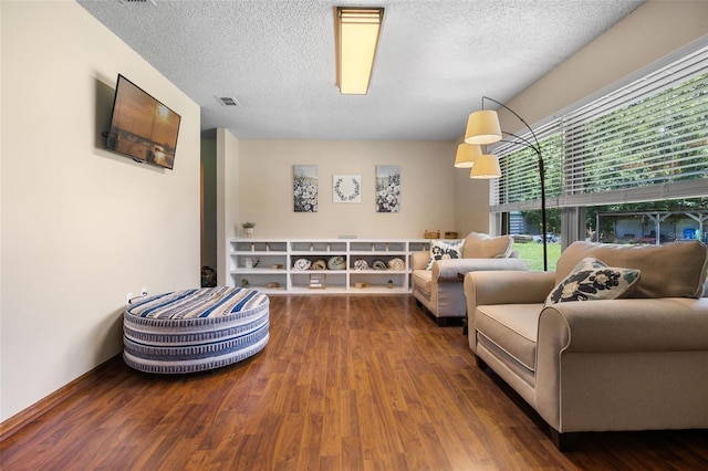 14325 Manchester Ave, Groveland, FL 34736 - sitting room with wood finished floors and a textured ceiling