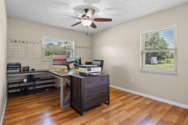 14325 Manchester Ave, Groveland, FL 34736 - office area featuring a ceiling fan, wood finished floors, and a textured ceiling