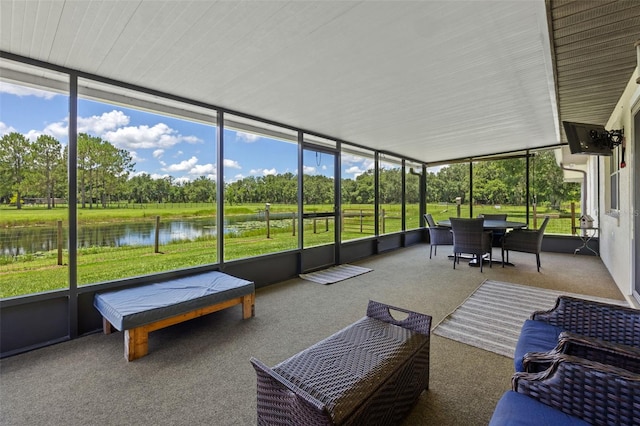 14325 Manchester Ave, Groveland, FL 34736 - sunroom with a water view, view of wooded area, healthy amount of natural light, and outdoor dining space
